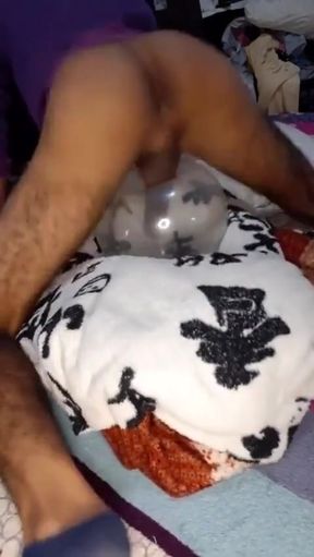 Young Man Masturbates with Inflated Comdon