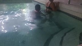 Stepmother walking by the pool models her feet and it excites me