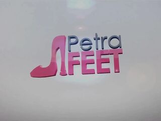 Leather Petra plays with her feet and smokes
