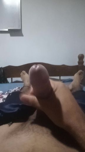 Young man de-stresses with a in his room while his neighbors talk