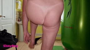tanned ass after a solarium. crossdresser in a chastity belt in a thong from a tanning bed.
