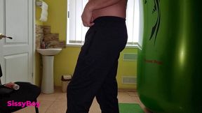 tanned ass after a solarium. crossdresser in a chastity belt in a thong from a tanning bed.