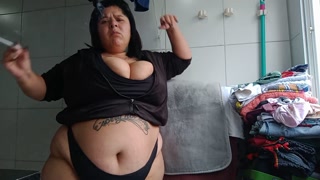 Busty smoking in the laundry room