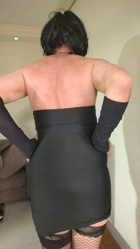 exhibitionist crossdresser brunette showing off her body in a strapless dress.