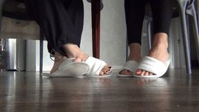 Wiggling our toes under the dining table in slippers c