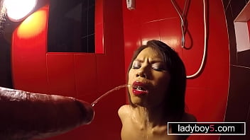 Restrained petite Asian teen ladyboy pissing and big cock blowjob