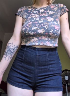 Busty woman with a sense of humor shows off her massive cups