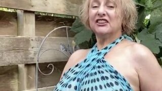Hot mature blonde teases with her huge tits outdoors