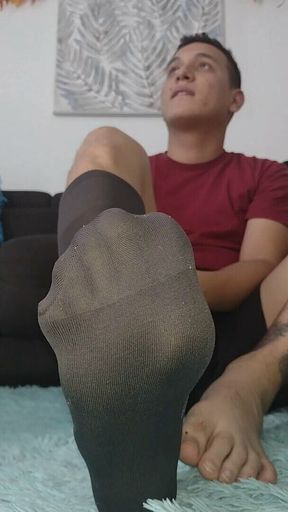 Latino Plays with His Office Stockings