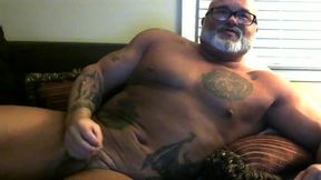 Older Muscular Man with Grey Beard Flexes and Plays with Hard Cock