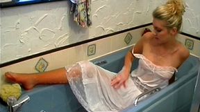 Blonde babe Brook in the bath with wet petticoat and panties