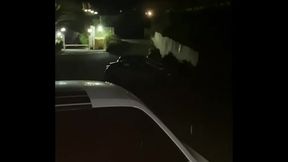 On the street in front of everyone