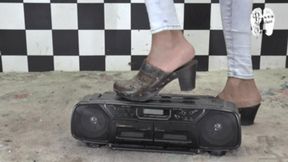 Radio under old worn Clogs