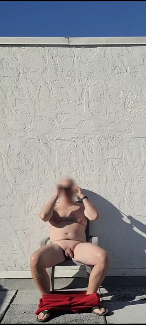 Exhibitionist masturbator stroking myself on a friend's rooftop deck