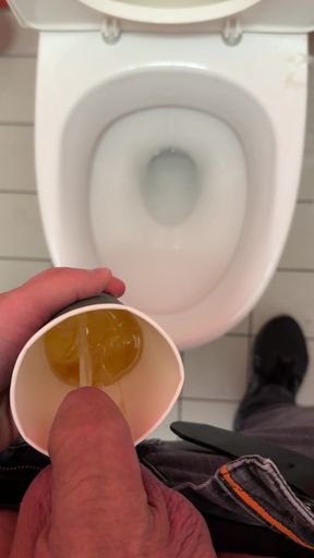 Making a pissdrink on a festival toilet