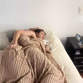 Lesbian sex under the covers on a cold morning