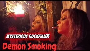 Sexy demonic witch smoking multiple camel cigarettes until her soul is satisfied