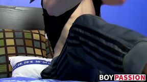Cutie jerks off on the bed with a big dildo deep inside him