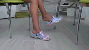 Dangling and toe tapping in colored rubber slippers A?