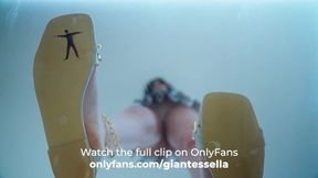 Giantess girl squishes tiny shrunken guy under her sandals