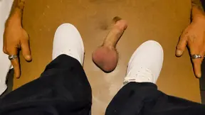 Squishing his cock with white keds