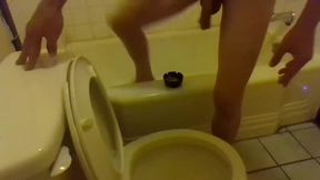 Pissing in the Toilet While Standing on the Bathtub