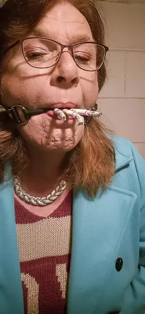 Smoking 3 cigarettes through a ballgag and eating the ashes