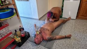 husband lying on his back drinking piss & cum through a funnel