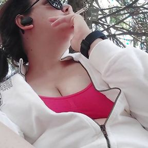 Smoking in a Public Garden Tits Outside and Feet in Flip Flops