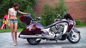 Sexy Rider Strips by Motorcycle, Teasing Her Tight Pussy Delightfully