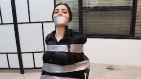 Teacher Lola Anderson humiliated in tight tape bondage by one of her students!