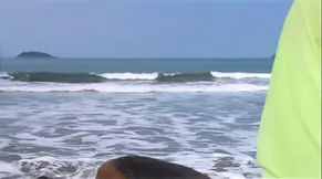 Two gorgeous sluts share a huge cock on the beach