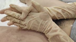 Latex glove play with sheathed cock