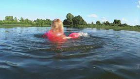 Alla swims on the lake and wears a pink inflatable vest and inflatable armbands for safety!!!