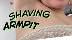 Shaving hairy armpit