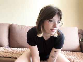 Nice-looking brunette hair widens her legs.