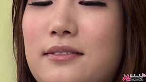 Japanese woman Mikuni Maisaki loves to tease herself on the couch with a sex toy