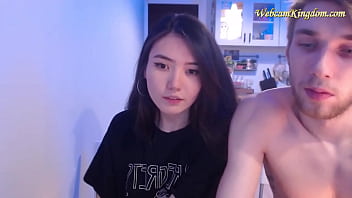 Skinny Asian girl flashes her assets on webcam with white guy