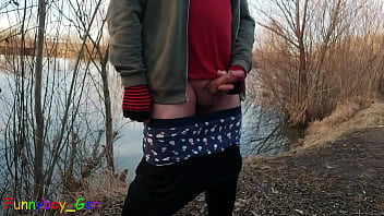 Outside by the lake, jerking off with a band around your cock and balls and showing your asshole (S)