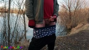 Outside by the lake, jerking off with a band around your cock and balls and showing your asshole (S)