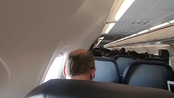 Teen brunette gets blowjob on public airplane