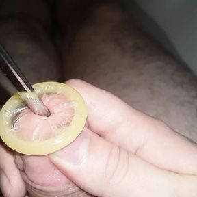 Rolling condom into urethra, urethral sounding, Close Up