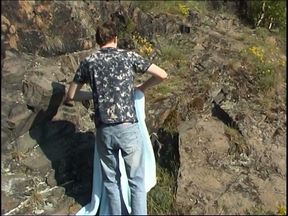 Young twink jerking his dick while on picnic