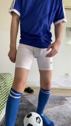 boy wearing blue football socks
