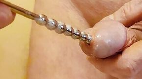 Insertion of my new extra long urethral plug.