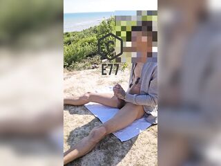 Playing with my large schlong on the beach