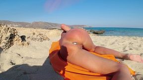 sex with anal plug on the beach