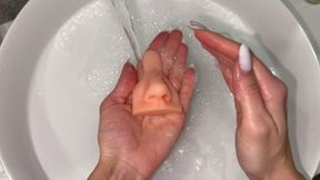 Nastya washes a toy rubber nose