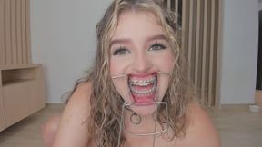 Irina Silver, blonde big boobed submissive with braces performs BDSM punishments and gets rewarded with multiple squirts while having her boobs chained and clover clamps spreading her pussy