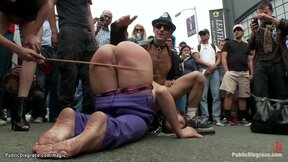 Big Titted slave caned on the street